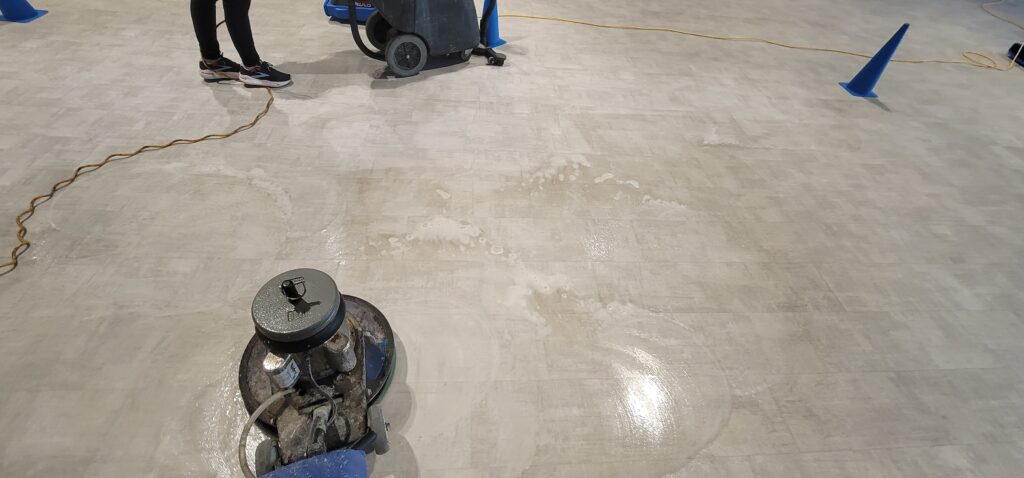 Professional LVT floor cleaning with floor machine in Tampa Bay