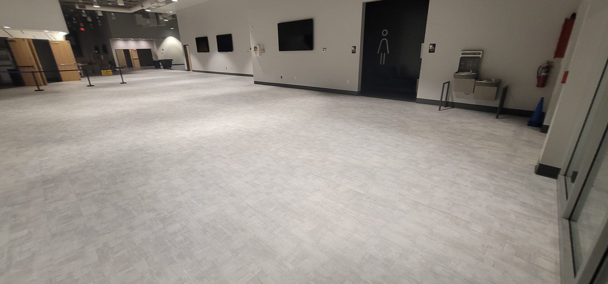 Professional luxury vinyl tile floor cleaning in a commercial facility